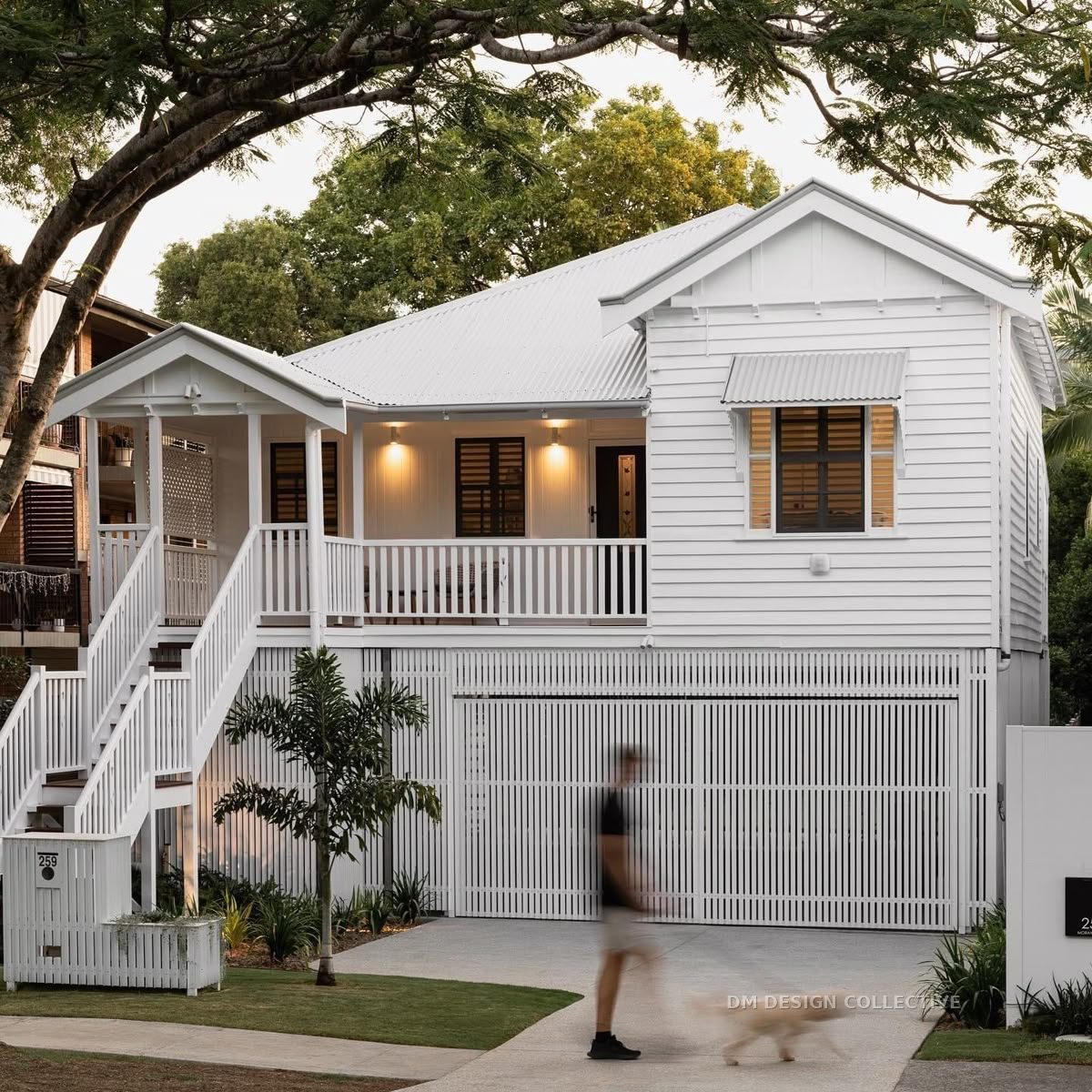 Raised Queenslander home elevated on new posts — house raising design